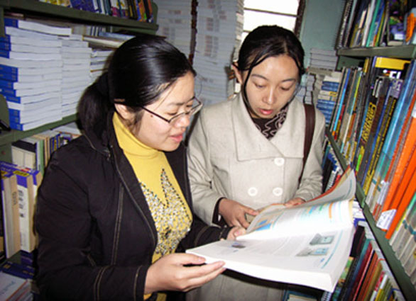 Selecting books from Bridge to Asia donations